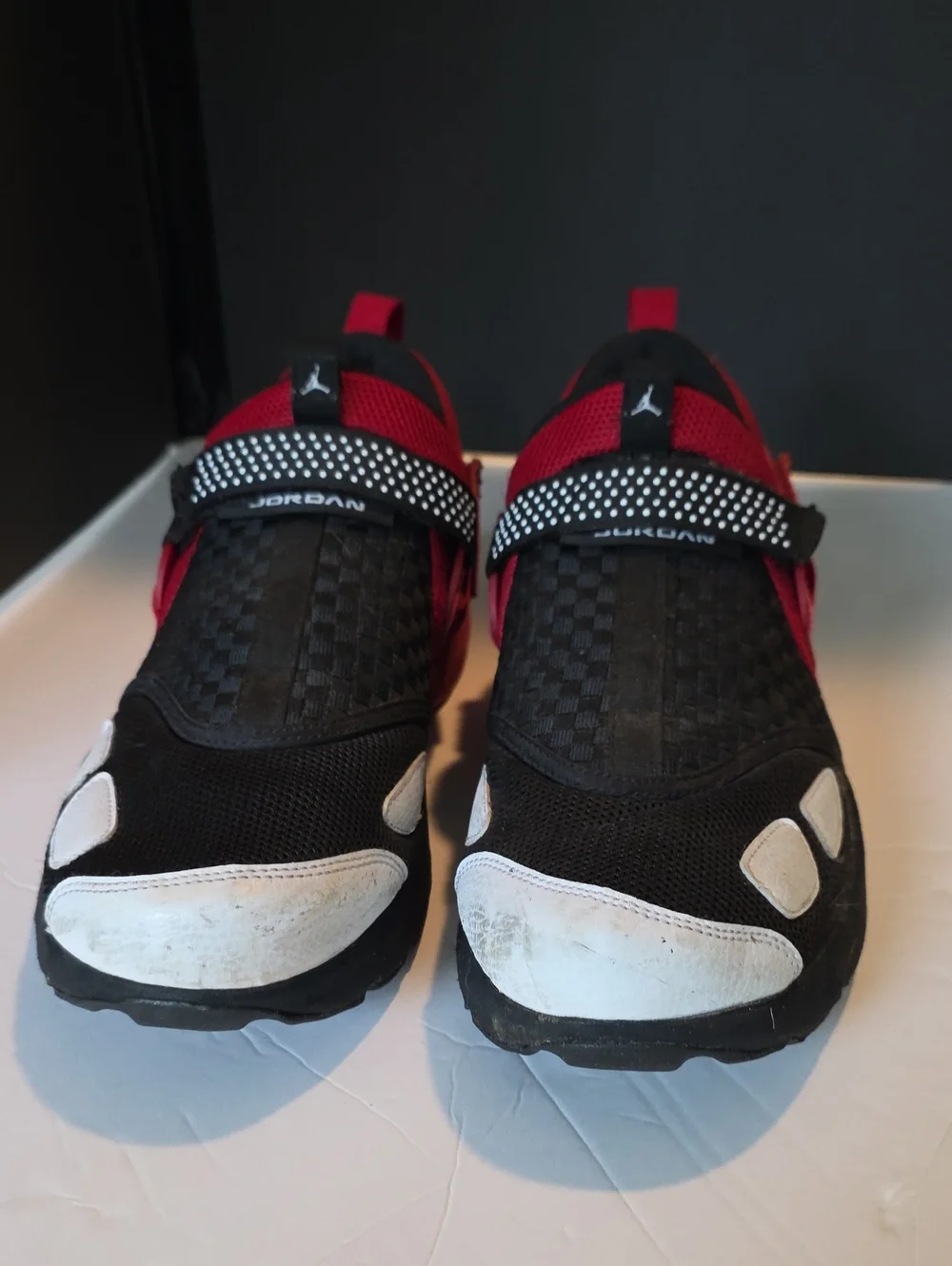 Jordan Trunner Black and Red Slip-On Sneakers